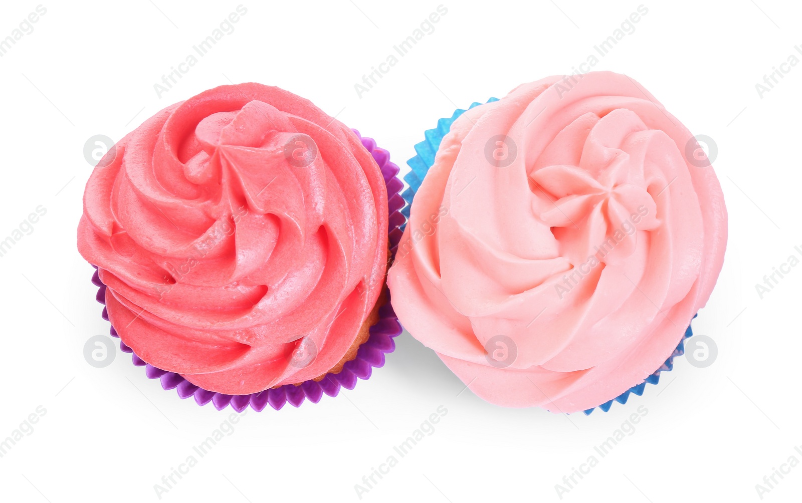 Photo of Different tasty cupcakes with cream isolated on white, top view