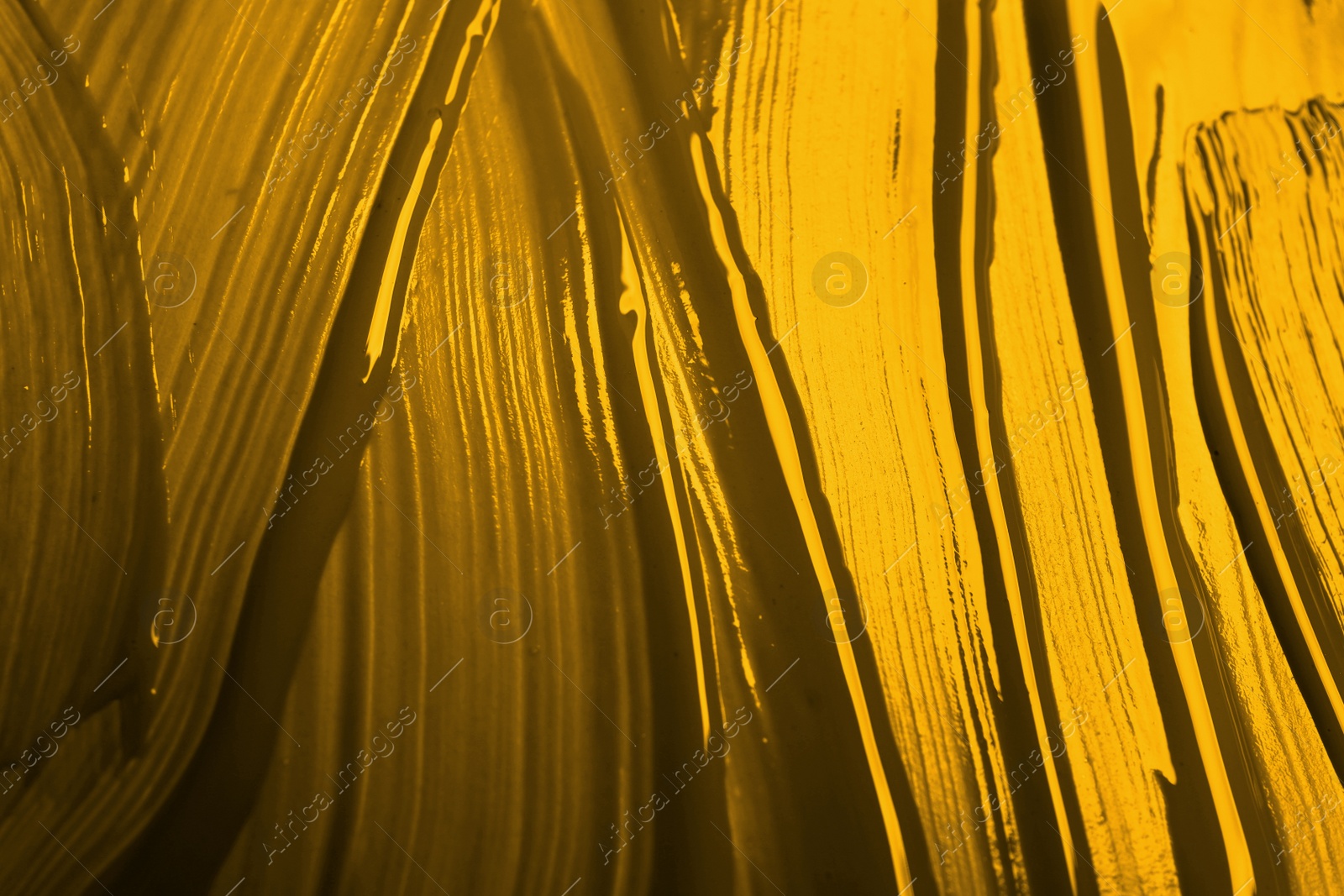 Image of Golden paint strokes as background, top view