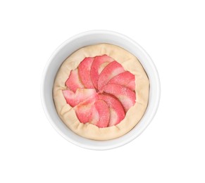 Photo of Baking dish with fresh dough and apples isolated on white, top view. Making galette