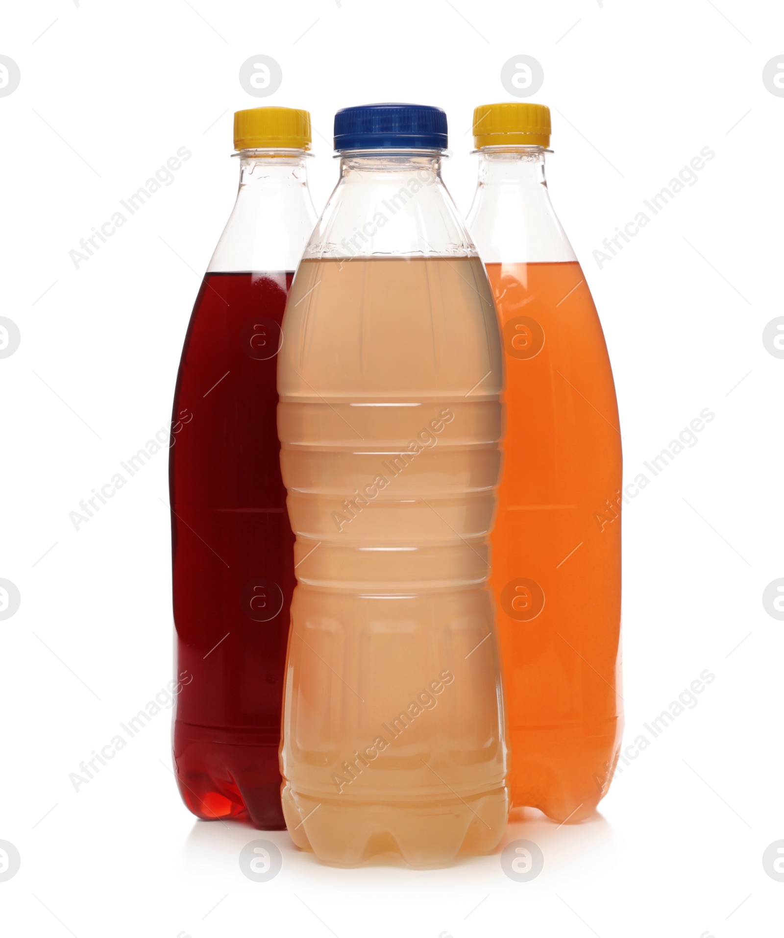 Photo of Bottles of soft drinks on white background