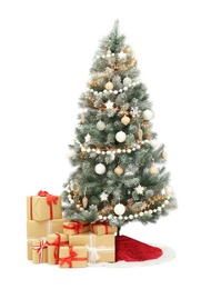 Photo of Decorated Christmas tree with red skirt and gift boxes on white background