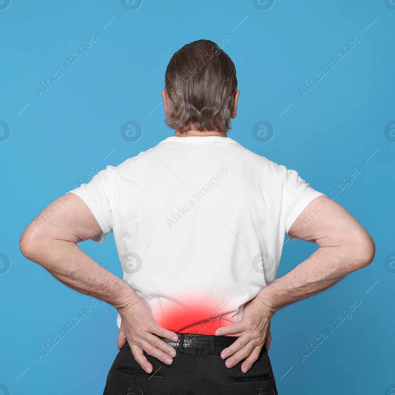 Image of Senior man suffering from rheumatism on light blue background