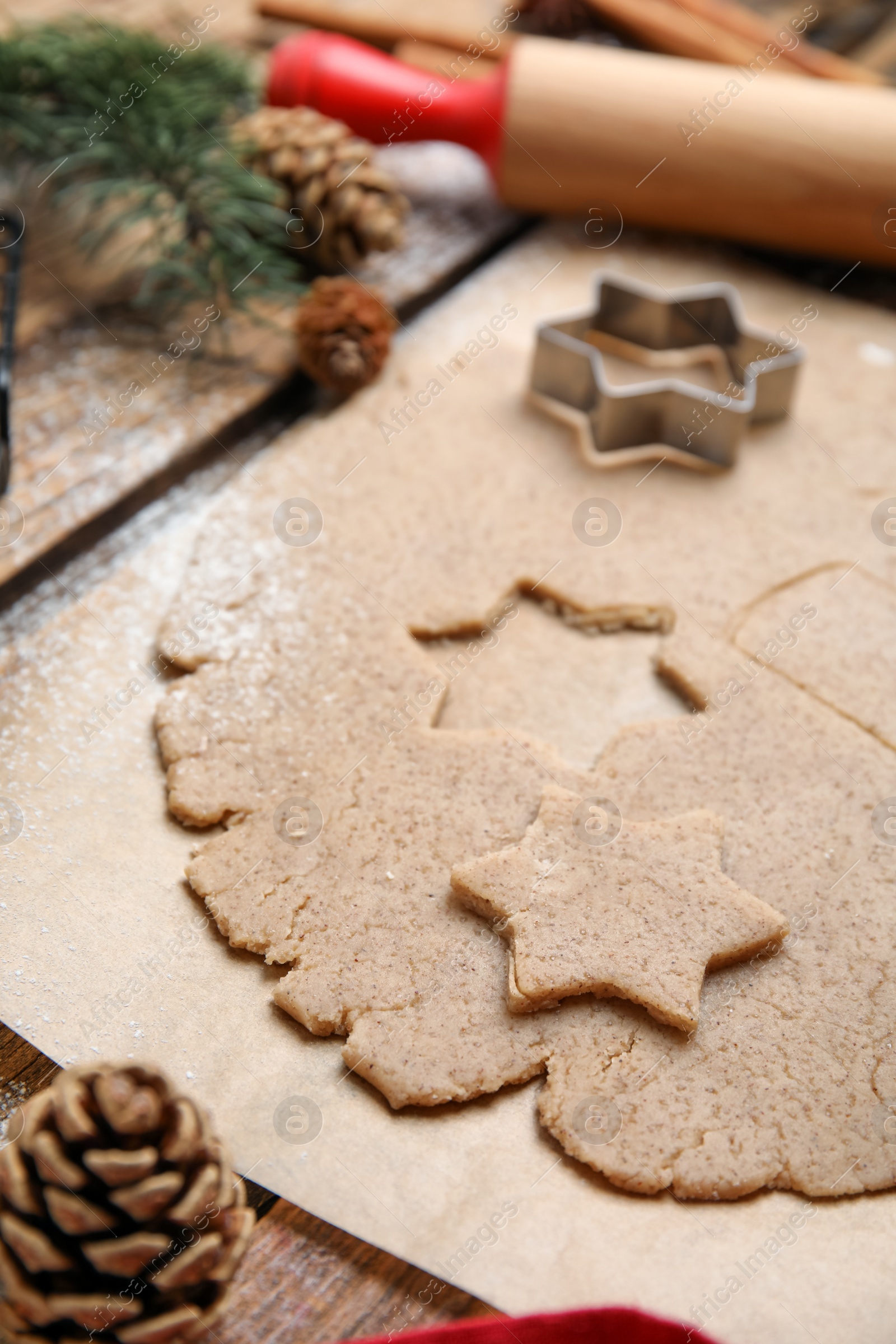 Photo of Homemade Christmas biscuits. Dough and cookie cutter on table, closeup