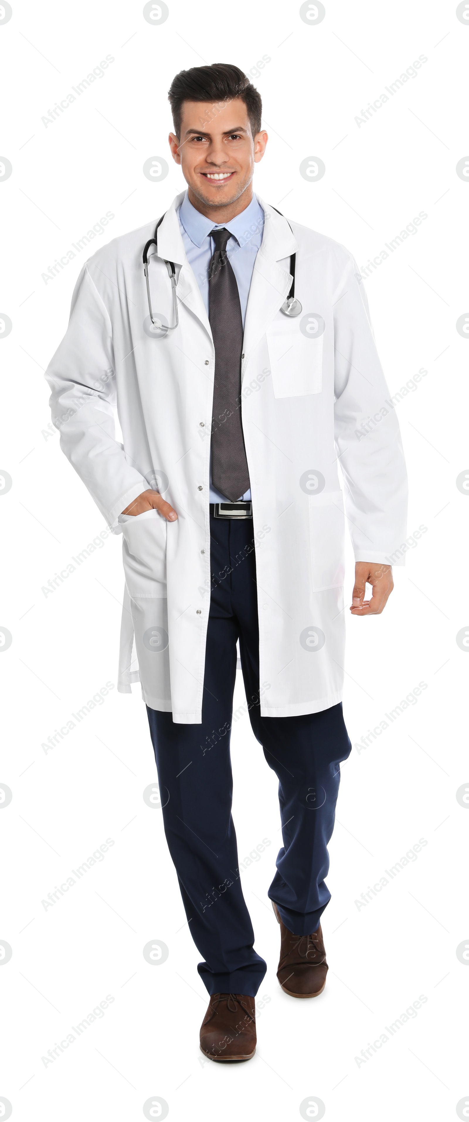 Photo of Full length portrait of medical doctor with stethoscope isolated on white