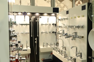 Photo of Assortment of metal water taps in store