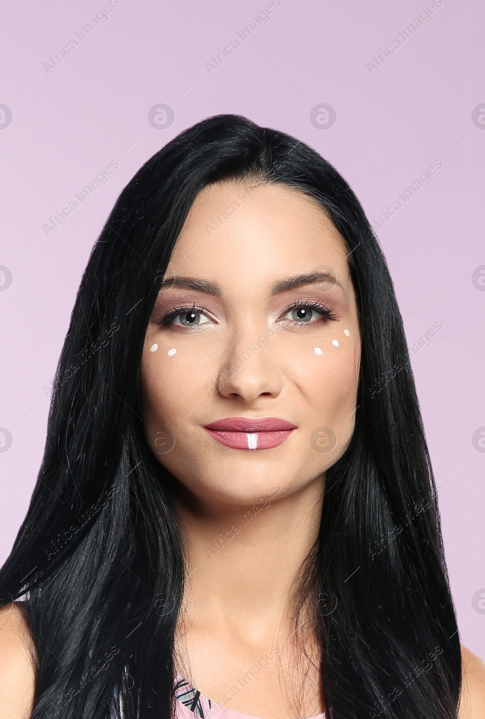 Photo of Portrait of young hippie woman with boho makeup on color background