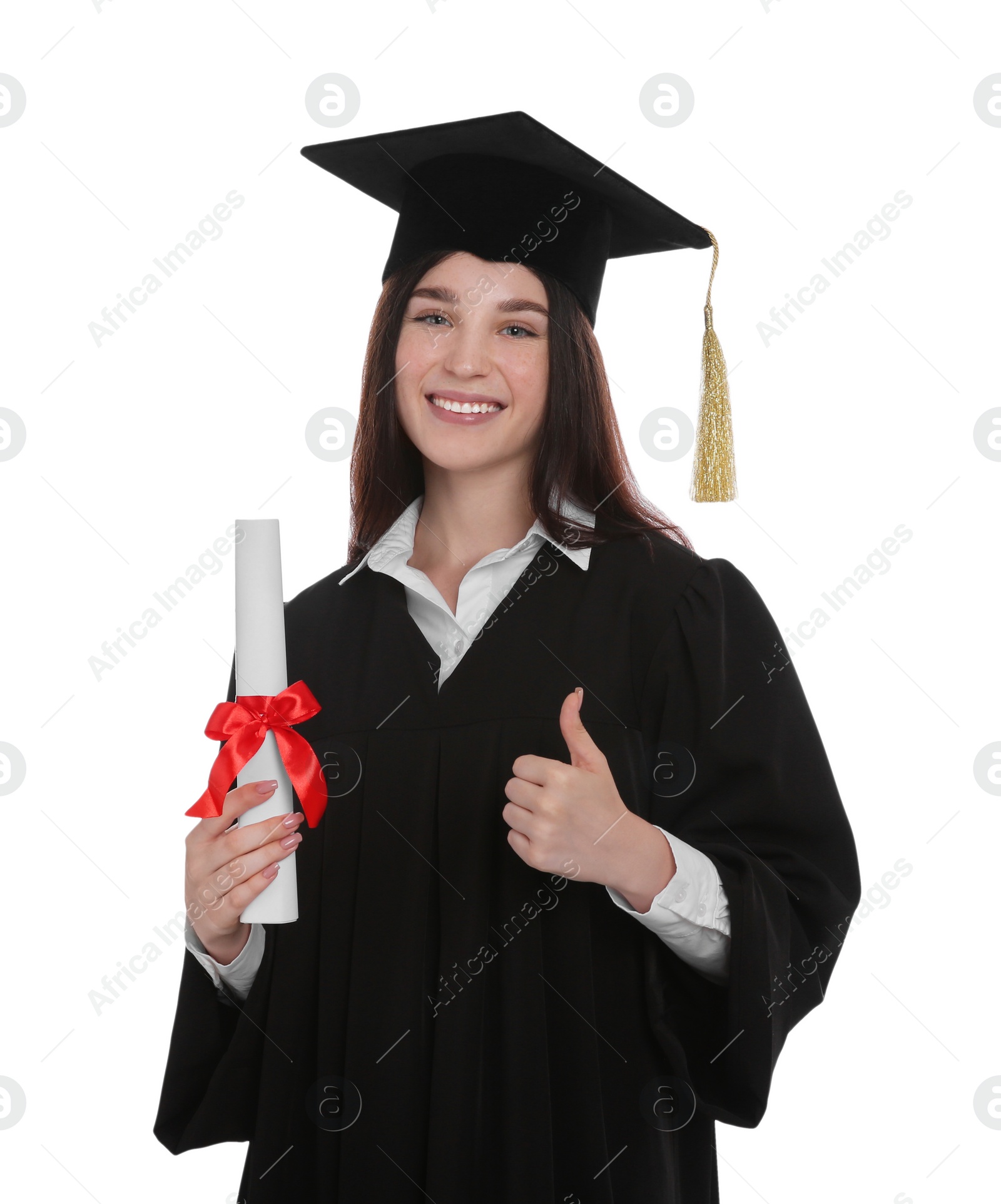 Photo of Happy student in academic dress with diploma showing thumb up on white background