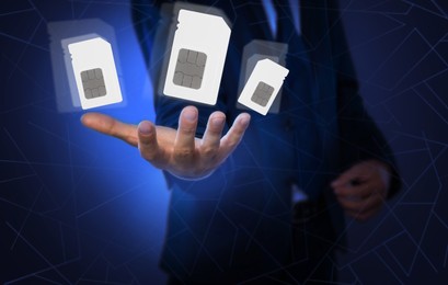 Image of Man demonstrating SIM cards of different sizes on color background, closeup 