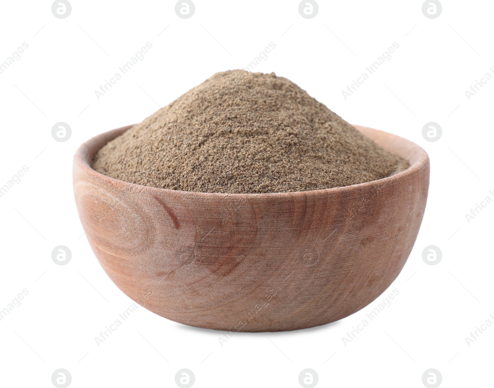 Photo of Spicy milled black pepper in wooden bowl isolated on white