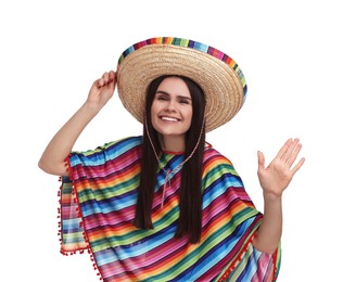 Young woman in Mexican sombrero hat and poncho waving hello on white background