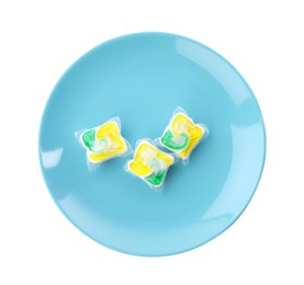 Photo of Light blue plate with dishwasher detergent pods on white background, top view