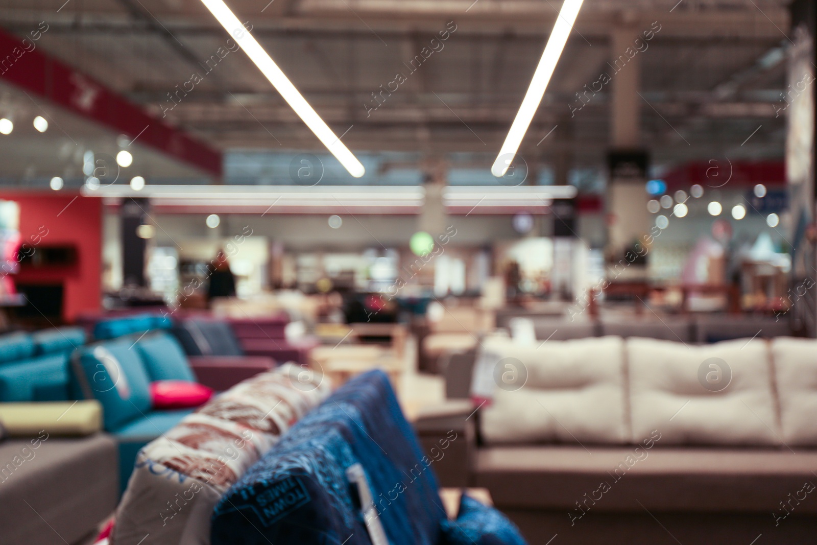 Photo of Blurred view of furniture store in mall. Bokeh effect