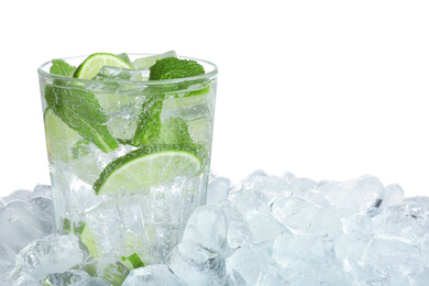 Ice cubes and delicious cocktail on white background