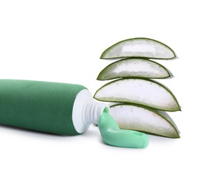 Open tube of toothpaste with cut aloe vera on white background