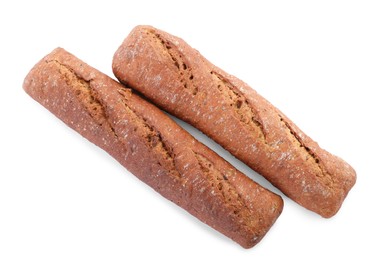 Tasty rye baguettes on white background, top view. Fresh bread