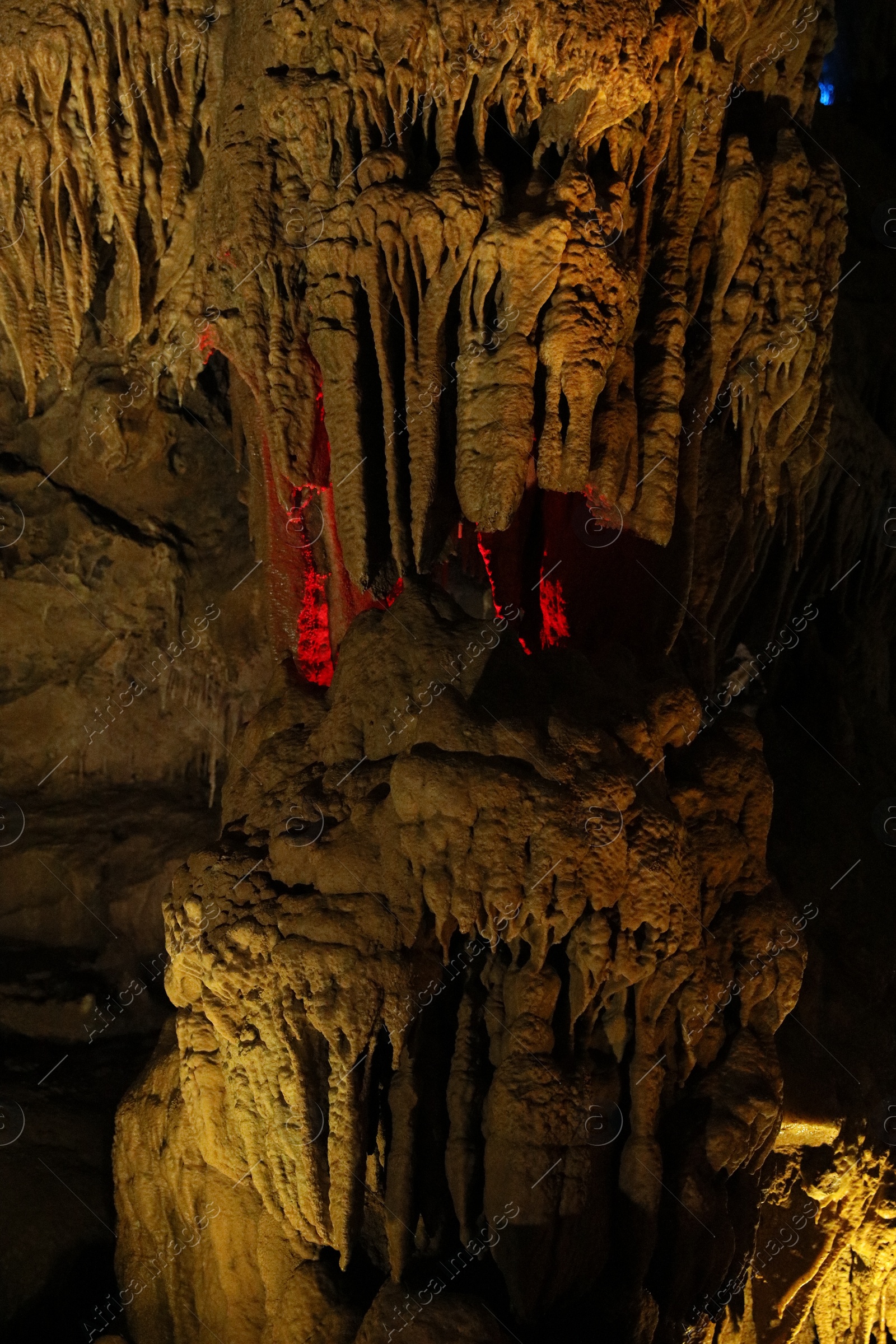 Photo of Picturesque view of many stalactite formations in cave