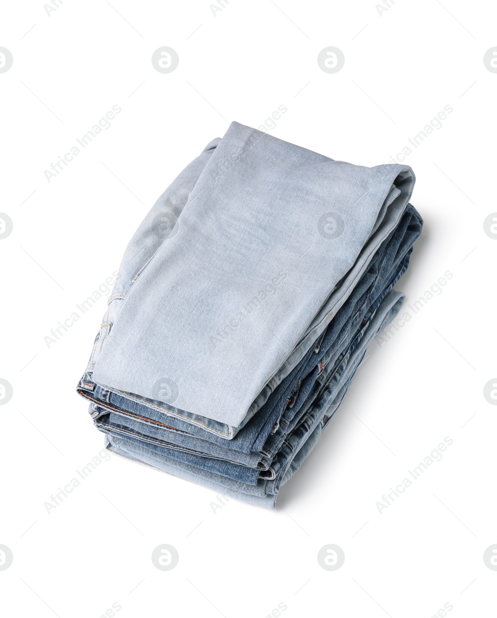 Image of Stack of different folded jeans isolated on white