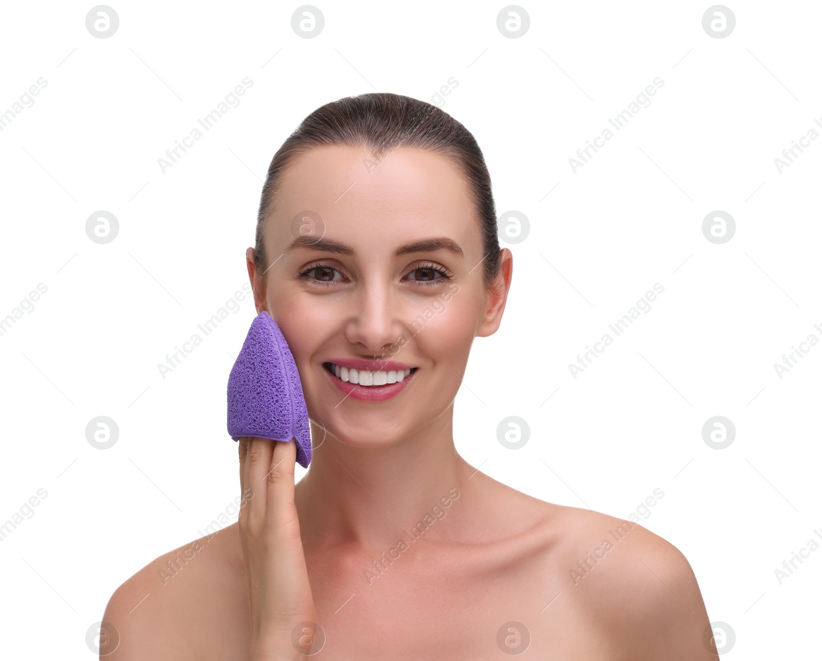 Photo of Happy young woman washing her face with sponge on white background