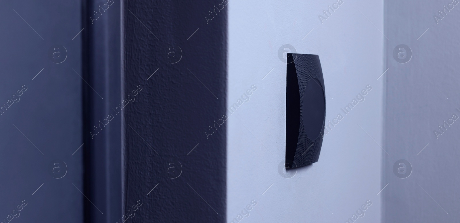 Photo of Magnetic door lock on light wall. Home security