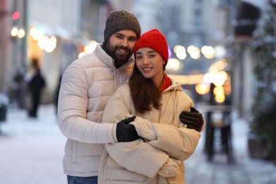 Photo of Lovely couple spending time together on city street