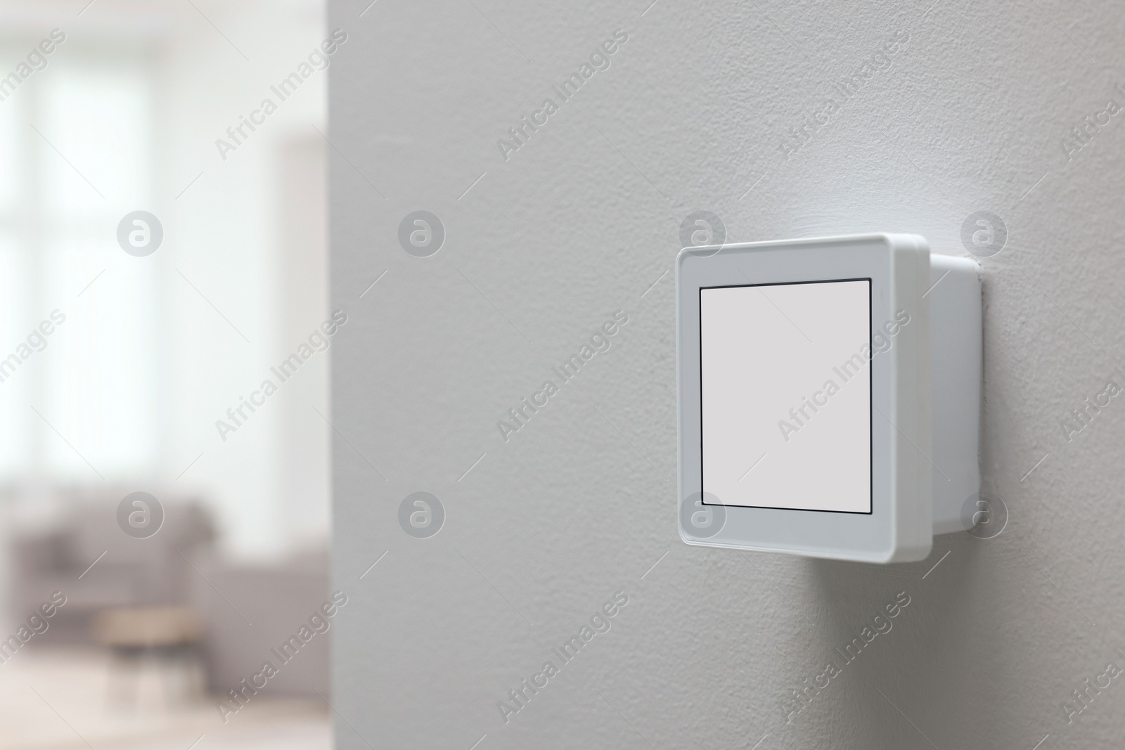 Photo of One thermostat on white wall indoors, space for text. Smart home system