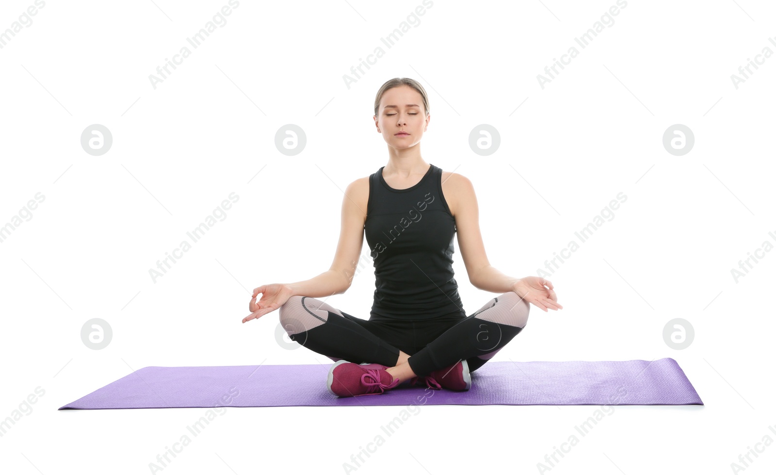 Photo of Young woman relaxing after training isolated on white. Home fitness