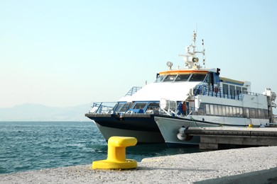 Picturesque view of ferry moored in sea port on sunny day