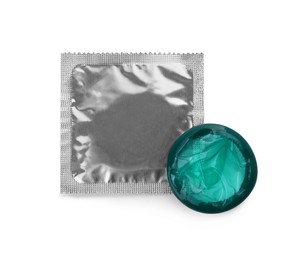 Photo of Package with condoms isolated on white, top view. Safe sex