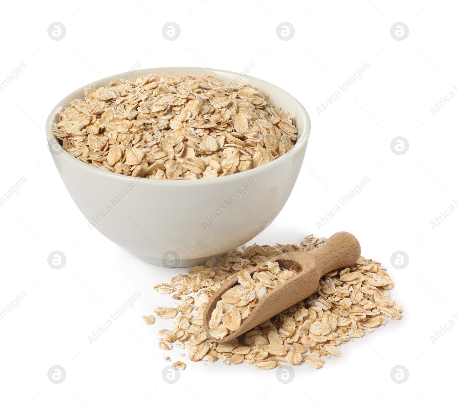 Photo of Bowl and scoop with oatmeal isolated on white