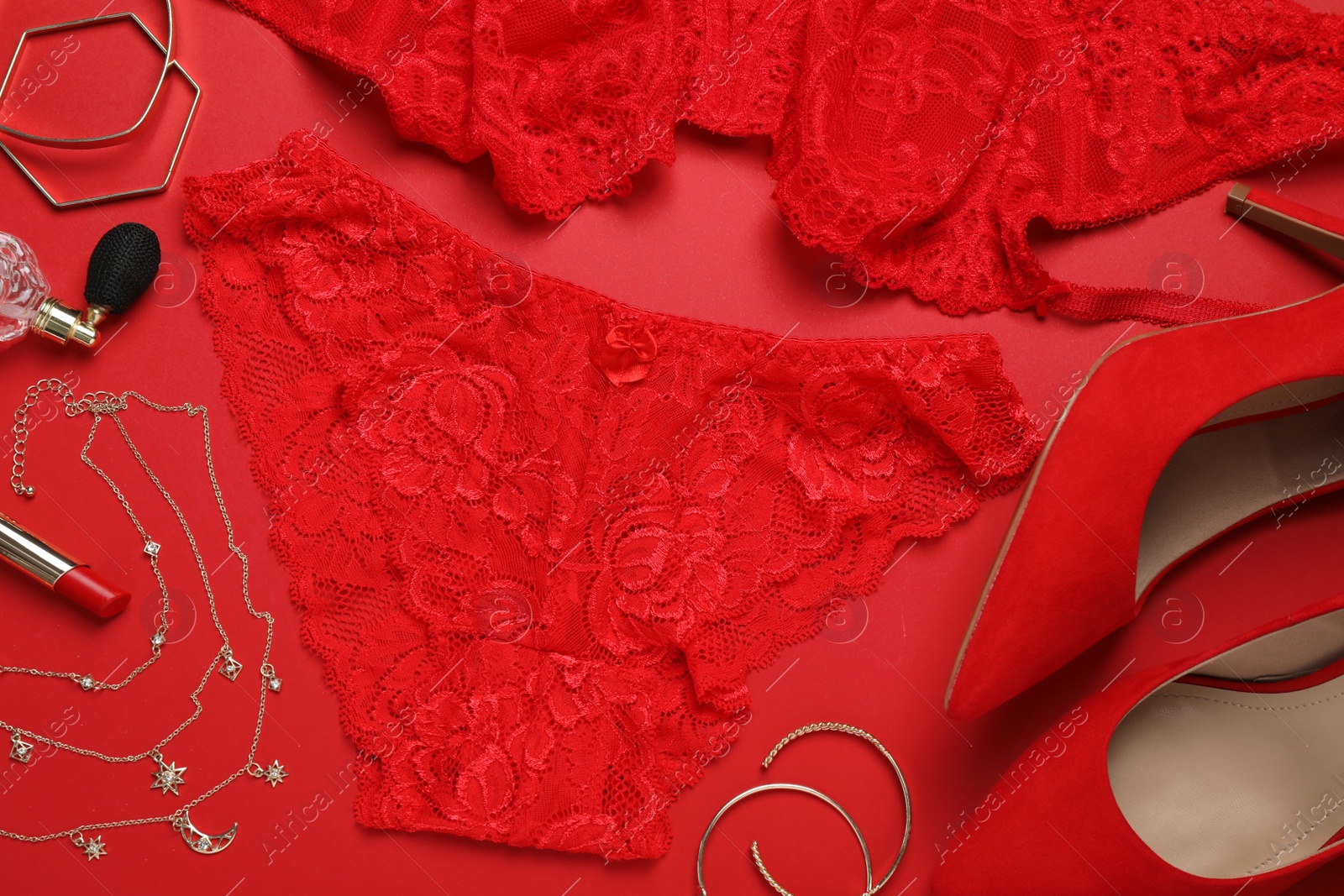 Photo of Flat lay composition with sexy lingerie on red background
