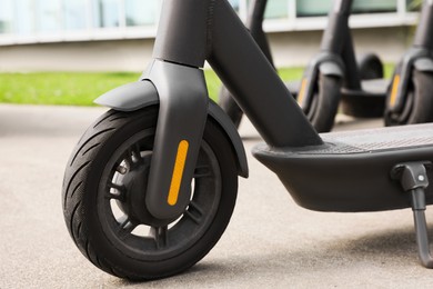 Modern electric scooter outdoors, closeup. Rental service