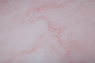 Photo of Texture of pink marble surface as background, closeup