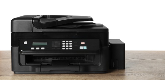 New modern multifunction printer on wooden table