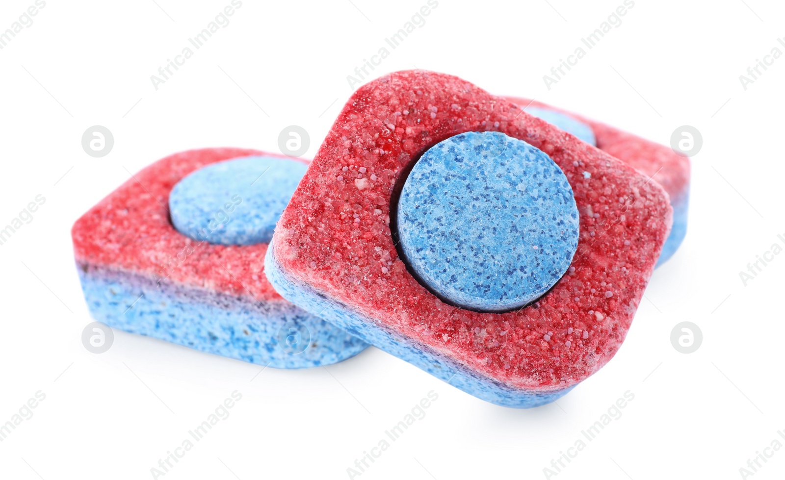 Photo of Many dishwasher detergent tablets on white background, closeup