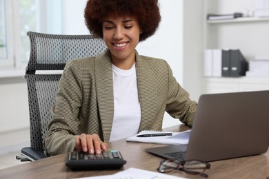 Photo of Professional accountant working at wooden desk in office