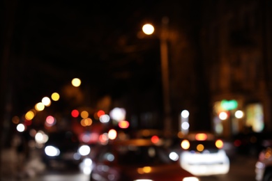 Blurred view of city street with traffic at night