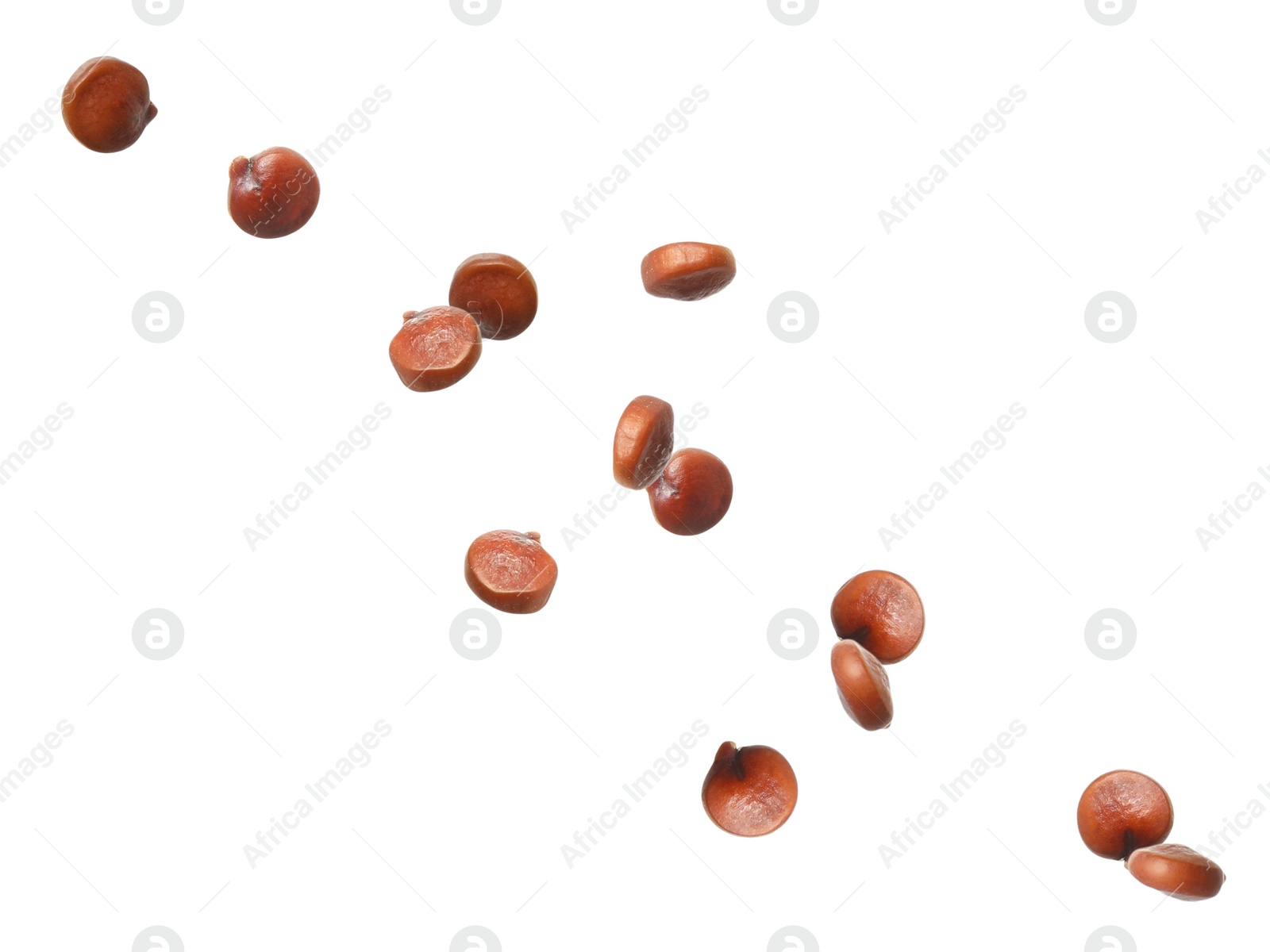 Image of Many quinoa seeds falling on white background. Vegan diet  