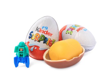 Photo of Slynchev Bryag, Bulgaria - May 24, 2023: Kinder Surprise Eggs, plastic capsule and toy space rocket isolated on white