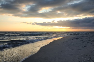 Photo of Picturesque view of beautiful sky with clouds over tropical beach at sunset