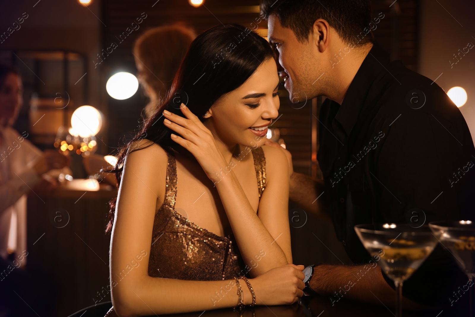 Photo of Man and woman flirting with each other in bar