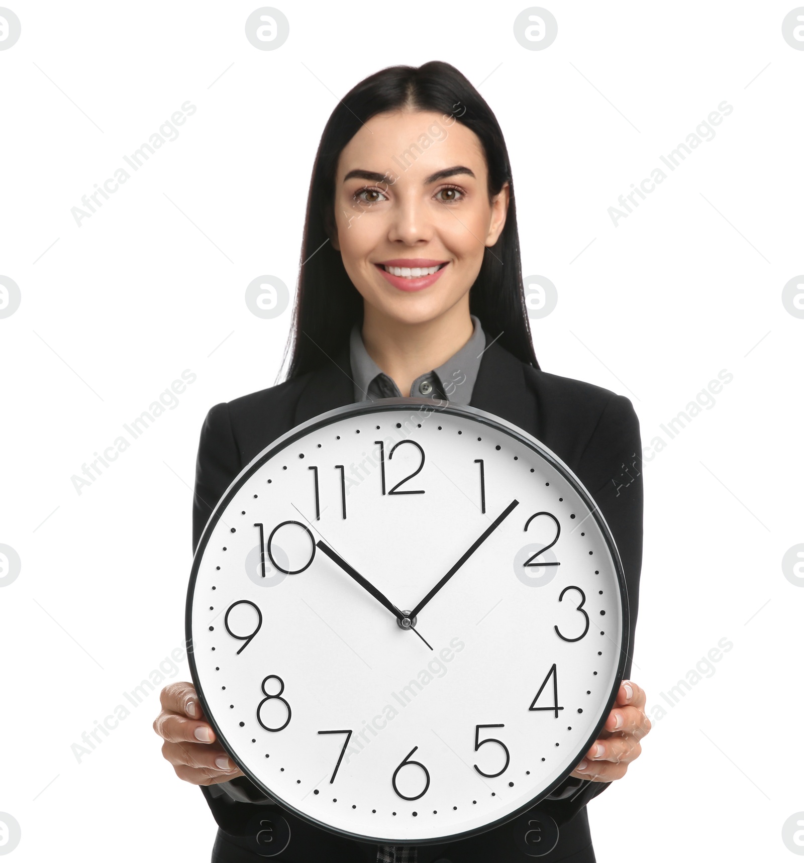 Photo of Businesswoman holding clock on white background. Time management