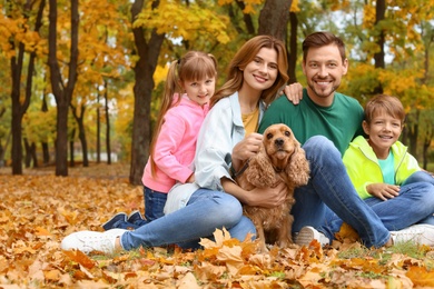 Photo of Happy family with children and dog in park. Autumn walk