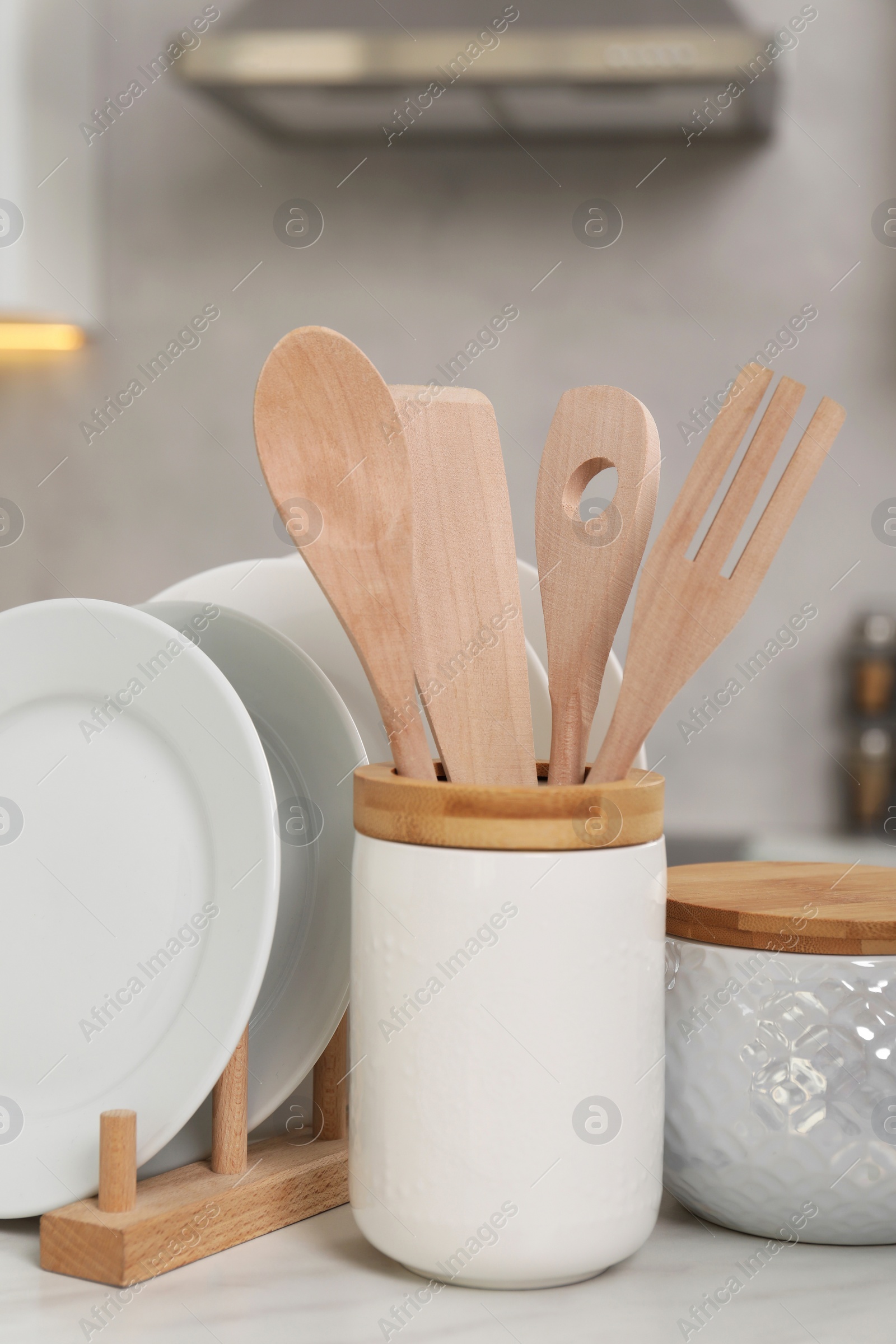 Photo of Set of different kitchenware on white table at home