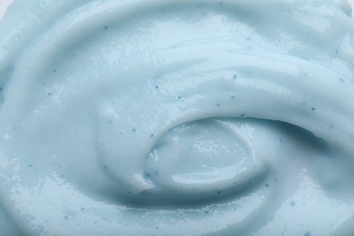 Closeup view of light blue body cream as background
