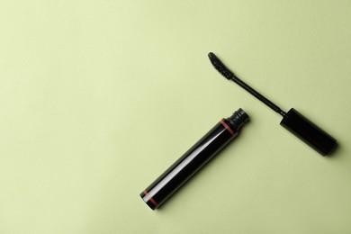 Mascara on light background, flat lay with space for text. Makeup product