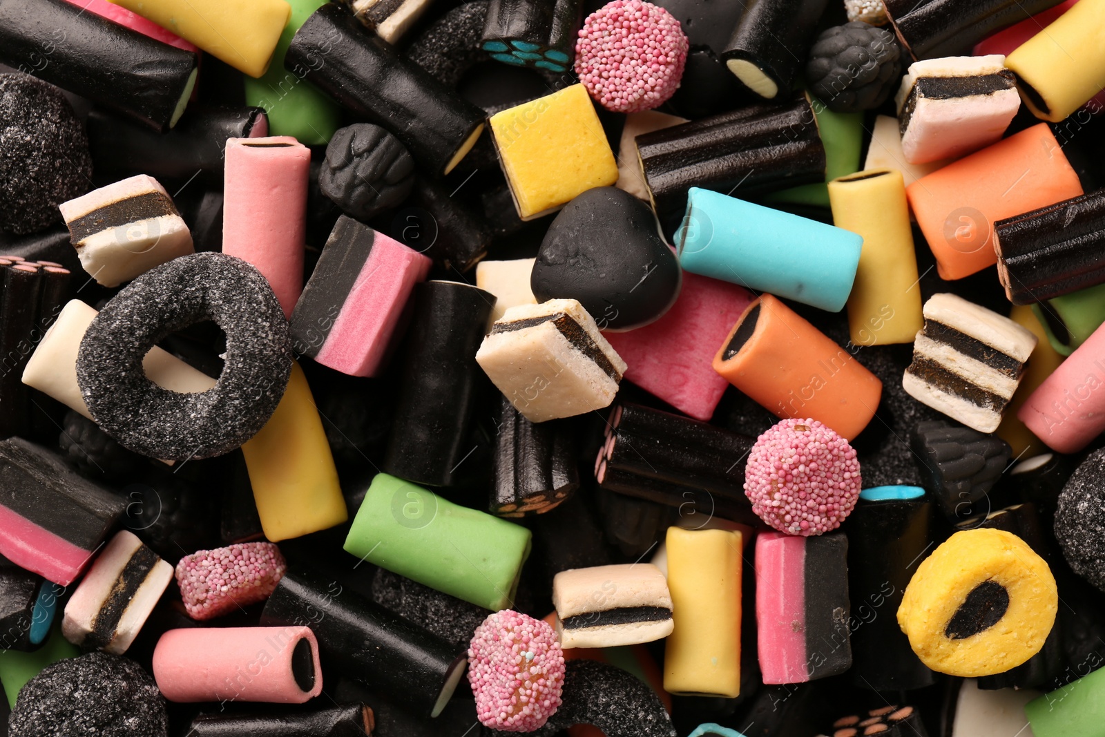 Photo of Many different liquorice candies as background, top view