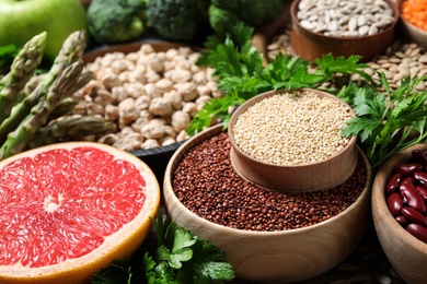 Fresh fruit, seeds and vegetables on table, closeup