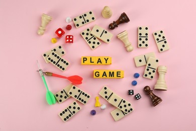 Photo of Flat lay composition of blocks with words Play Game on pink background