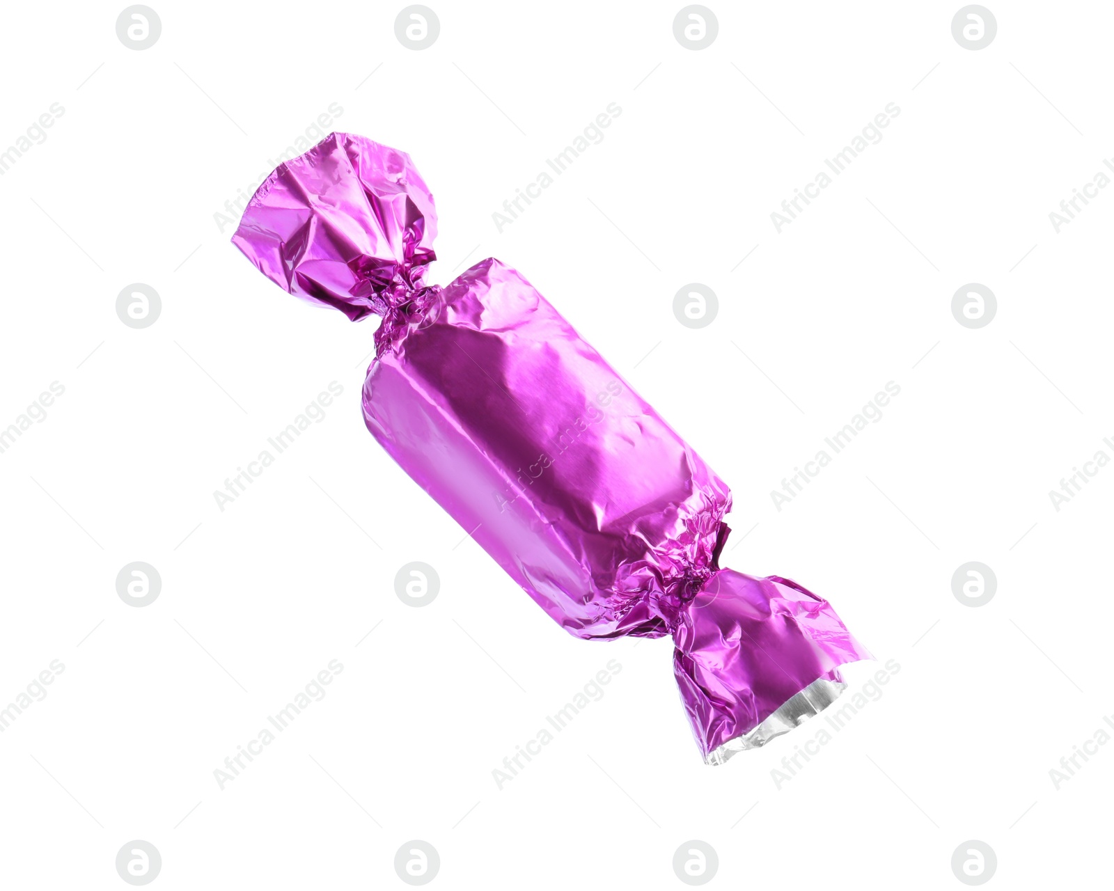 Photo of Tasty candy in violet wrapper isolated on white