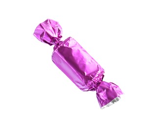 Tasty candy in violet wrapper isolated on white